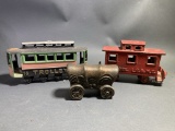 1 Cast Iron Train Car, 1 Cast Iron Trolly Car & 1 Aluminum Covered Wagon