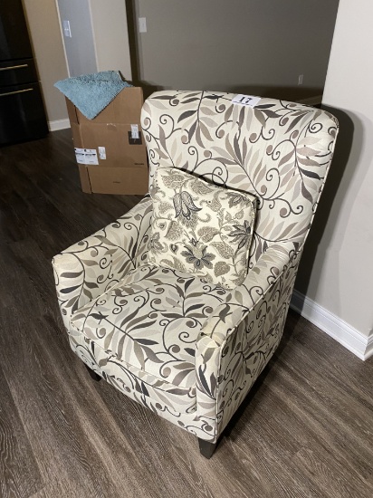 Upholstered armchair with pillow