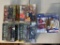 Group lot of action figures in packaging