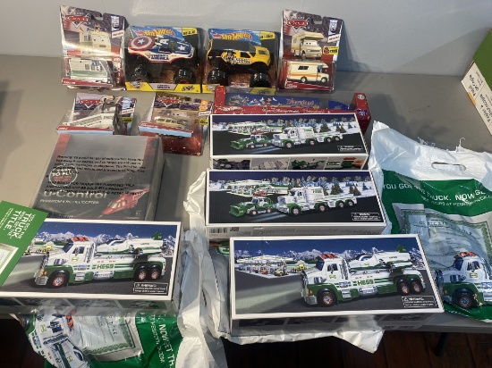 Large Lot of toys in packaging including Hess Trucks