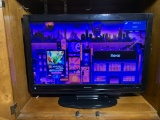 32 inch Sharp TV with Remote.  ROKU ADAPTER  NOT INCLUDED!