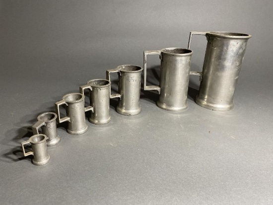 Group lot of vintage pewter graduated measures