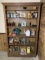 Basement Shelf with Decorative Items - Spiderman Puzzle, Vintage Bottles & More