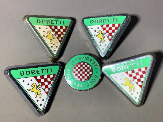 Group lot of Doretti Car Emblems