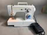 White Sewing Machine Model 1418.  Has Foot Pedal.  Powered On.