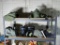Two Shelves of Military Items including Kevlar Helmet