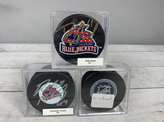 Rick Nash, Rostislav Klesla, and Derek Broussard Autographed Columbus Blue Jackets Hockey Pucks