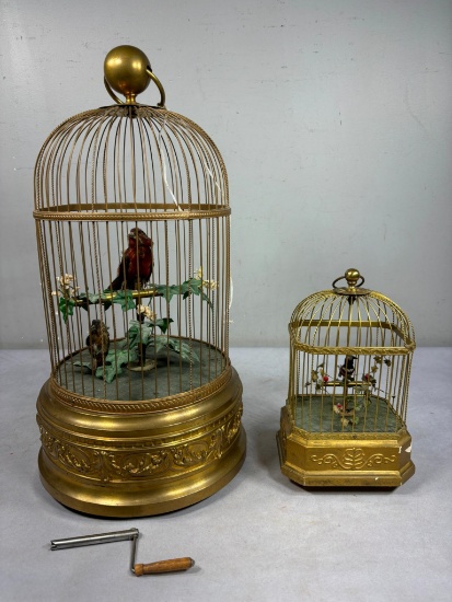 A Large and a Small Vintage Wind Up Bird Cage Toys with Singing Birds