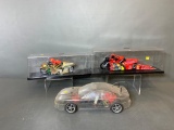 Radio Control Car with Clear Body and Two Radio Controlled Racing Motorcycles in Cases