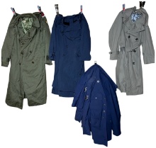 An Assortment of U.S. Military Uniforms and Equipment Including Army and Air Force Tunics and Trench