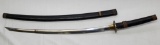 Katana in wooden scabbard showing wear having