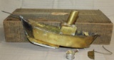 brass hot air powered boat in wood box with