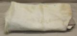 White fur cow hide tanned, showing some wear