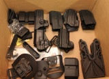 Large lot of injection molded plastic holsters -