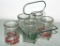 5 individual glass creamers with metal holder --
