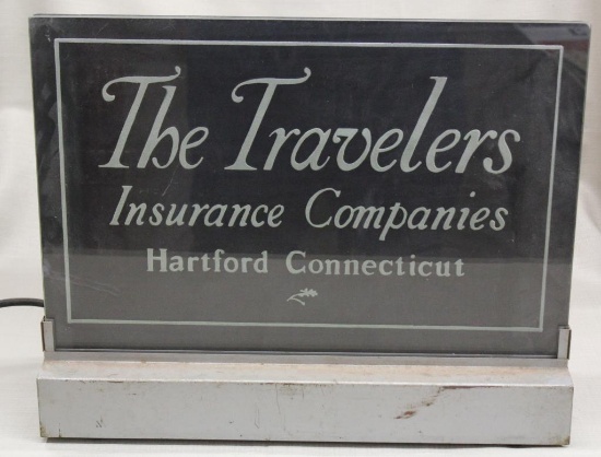 The Travelers Insurance Company glass lighted