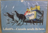 Labatt's Dog Sled poster, covered with plastic,