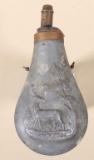 Embossed tin powder flask with adjustable copper spout and top.