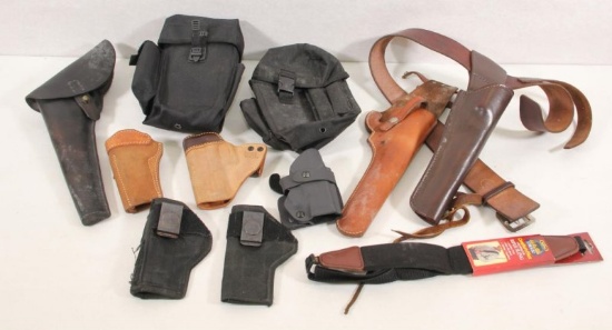 8 assorted holsters - leather, Keydex & other. Along with maga