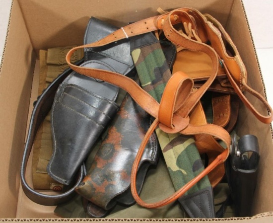 Assorted lot of leather holsters.