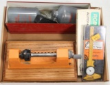 Lyman case trimmer; dial caliper; primer feed parts and MEC bottles.