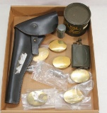 Flat lot to include 6 brass belt buckles, unmarked leather holster, sealed can of rifle grease,