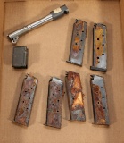 1911 barrel with compensator in .45 ACP along with 6 heavily rusted magazines and 1 En-bloc clip.