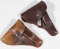 (2) small/medium side arm leather holsters showing assorted wear