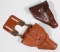 (2) small side arm leather holsters, one with hanger showing assorted wear