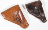 two brown unmarked medium sized pistol holsters showing some wear