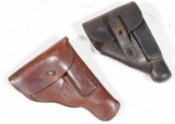 two unmarked medium sized pistol holsters showing some wear