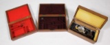 (2) wooden felt lined pistol display cases and Redding #2 scale in wooden chest
