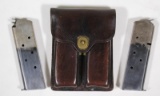 US J.O.M.D. 1950 leather double 1911 magazine carrier with two two-tone unmarked magazines