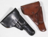 (2) medium side arm leather holsters showing assorted wear