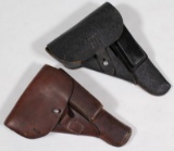 (2) leather side arm holsters unmarked, one with takedown tool showing assorted wear