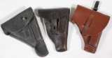 (3) leather medium/small side arm holsters, one with hanger, no markings, showing assorted wear