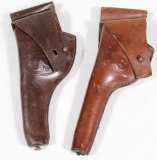 (2) US marked leather holsters R.I.A./1910/E.P. & G. & K./1917/A.G., showing assorted wear