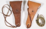 (2) US marked leather holsters both SEARS/1942, one with lanyard, showing assorted wear