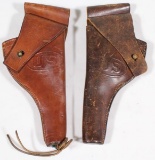 (2) US marked leather holsters marked on back B/67/CAC/23 & Textan/1942, showing assorted wear