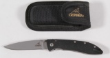 Gerber single blade folding knife with cloth sheath approximately 3