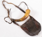 Period powder horn and leather essentials bag showing some wear with repair to horn bung