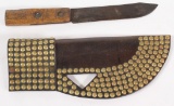 Indian trade style, brass button embellished leather knife sheath with approx. 200 buttons