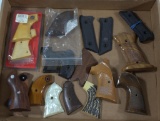 lot of assorted handgun grips to include (5)