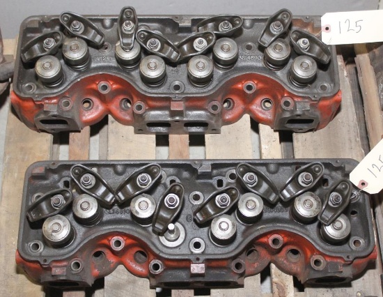 3 Chevy 409 stock cylinder heads,1 is bare