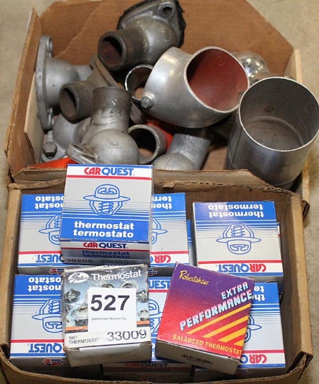 box of thermostat housings & 15 new thermostats
