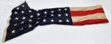 Large 48 star flag, 12'x6' showing wear and staining in places