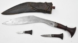 Kukri set in leather scabbard.  The main