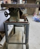small contractor table saw on stand used for