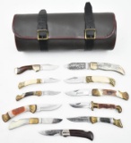 (11) assorted folding blade knives and a knife bed