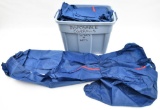 large tub full of safety coveralls and related